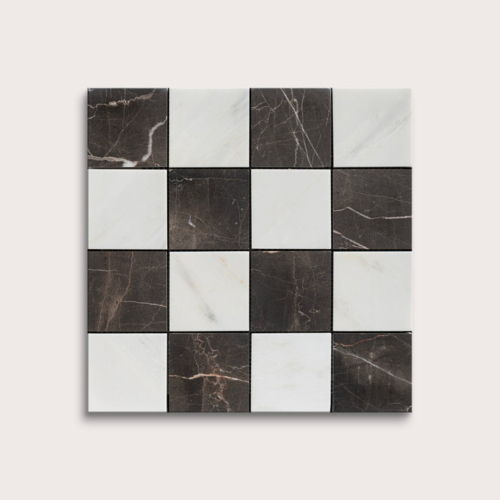 Checkered pattern of black and white marble tiles on a light gray background