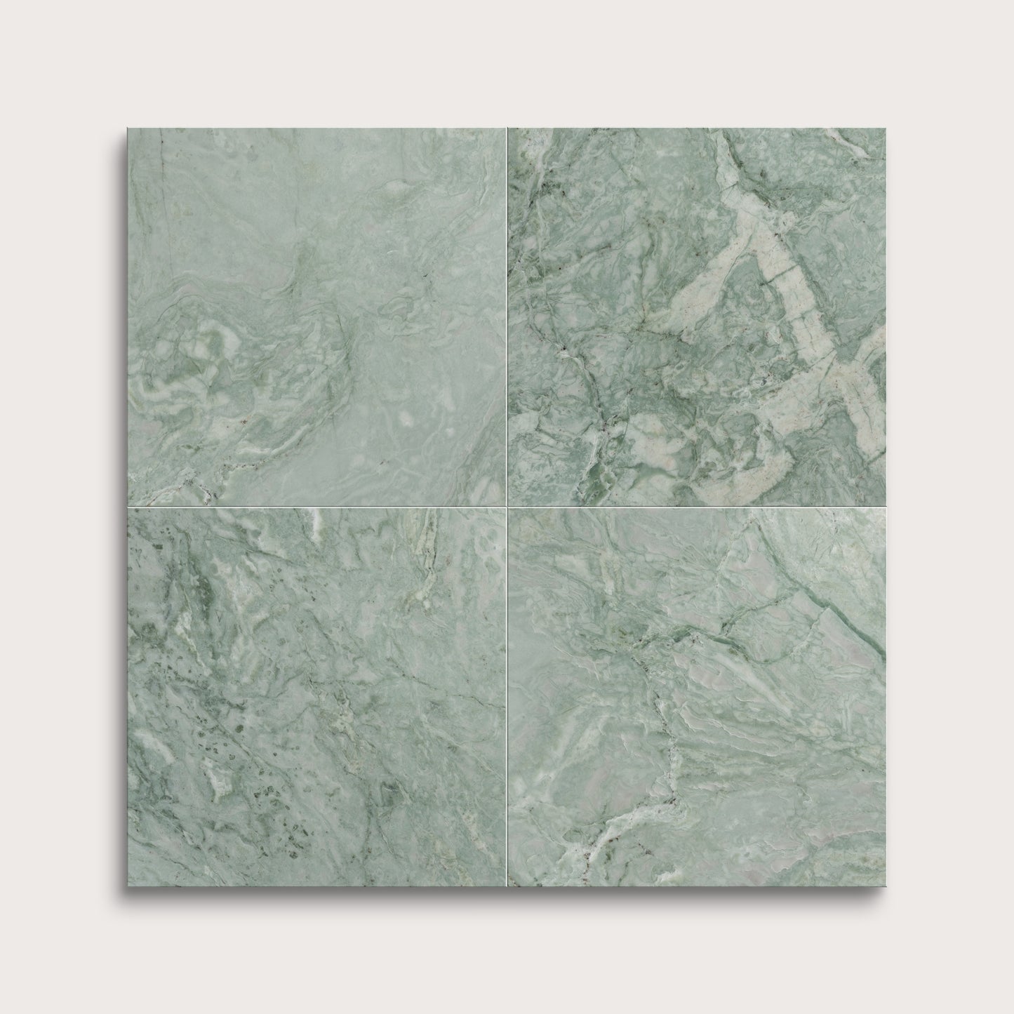 Four green marble tiles arranged in a grid pattern on a white background