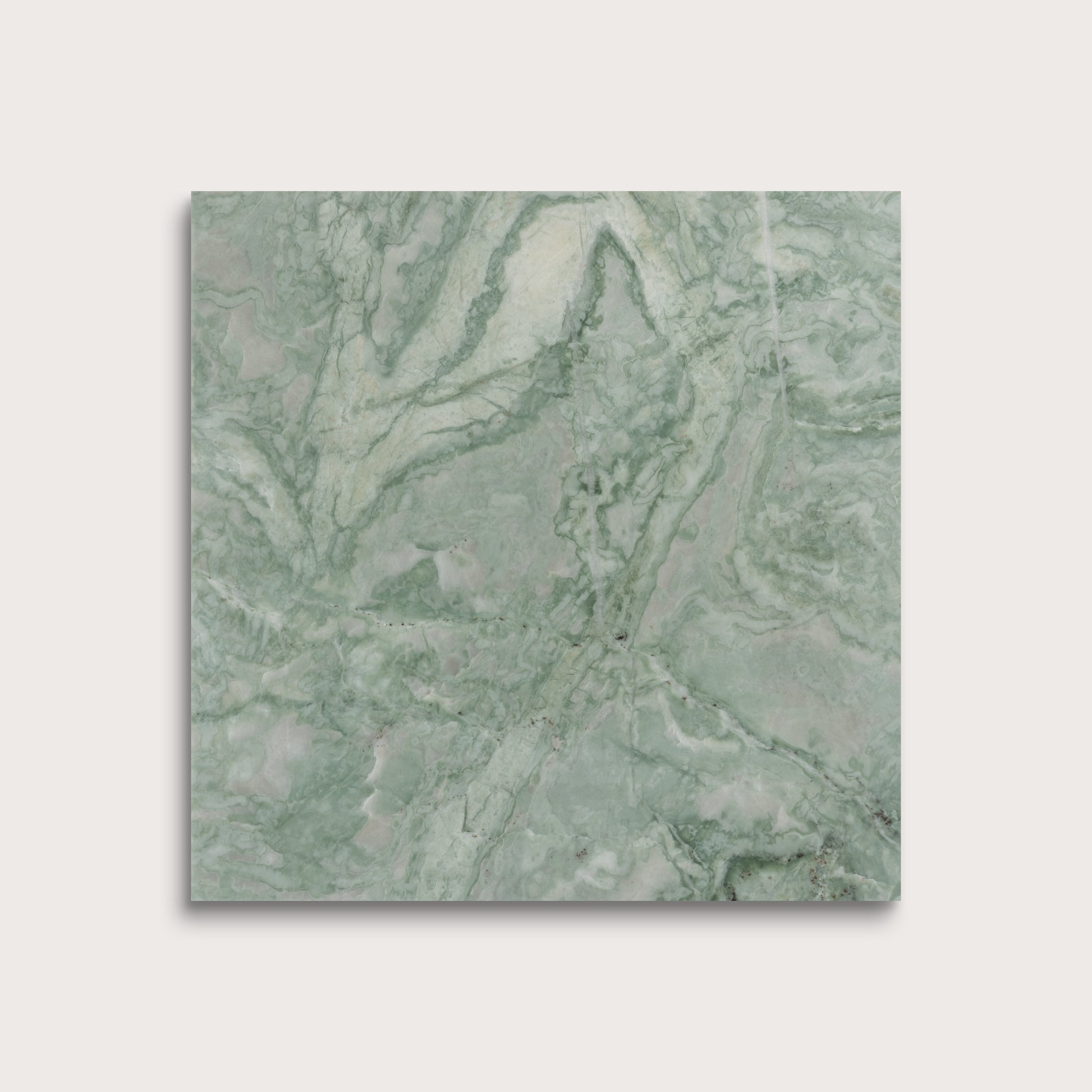 Green marble-patterned tile on a light gray background