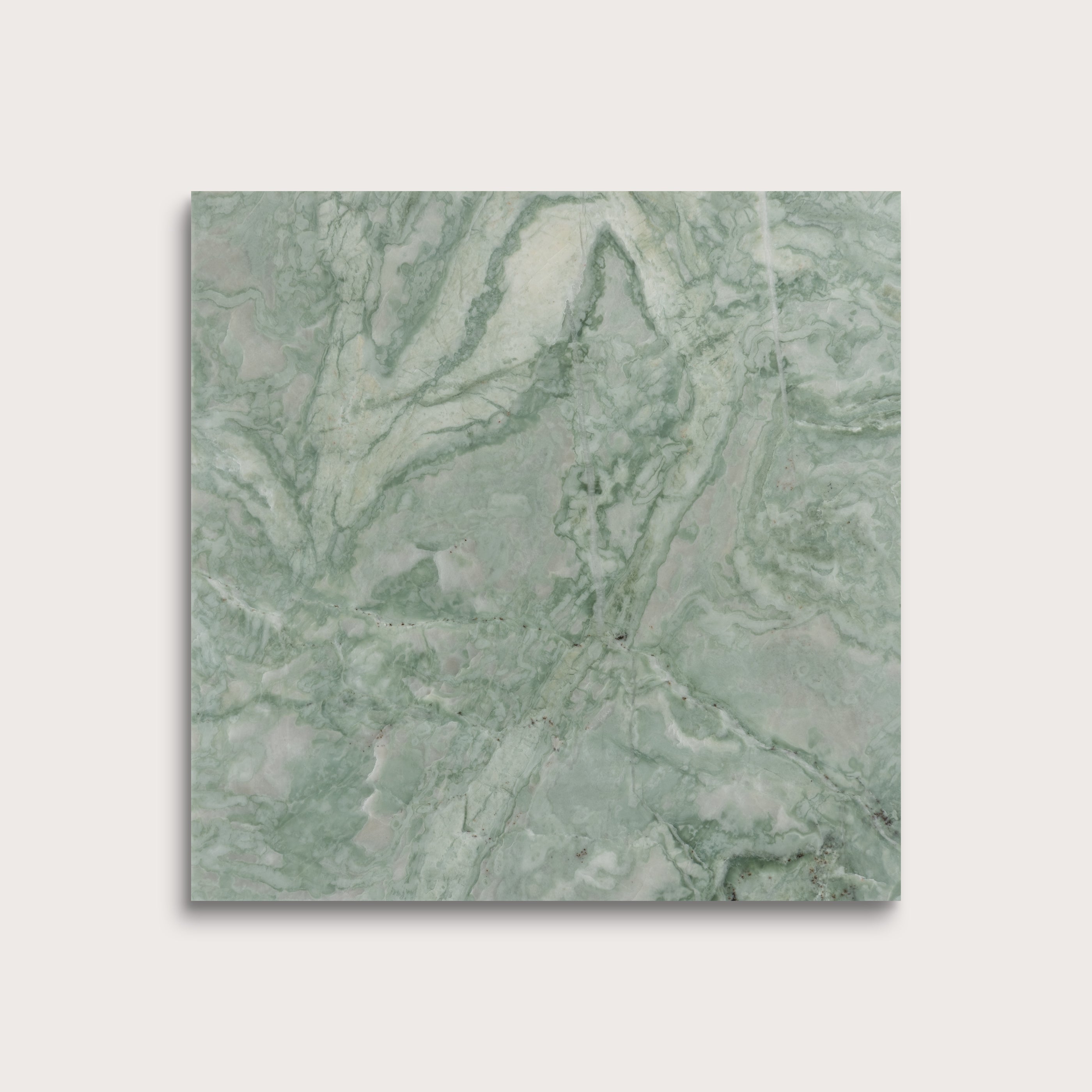 Green marble-patterned tile on a light gray background