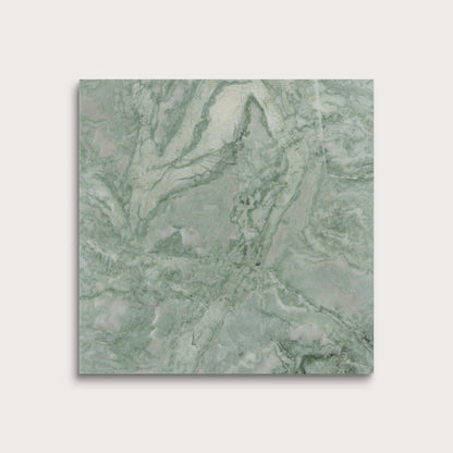 Green marble-patterned tile on a light gray background