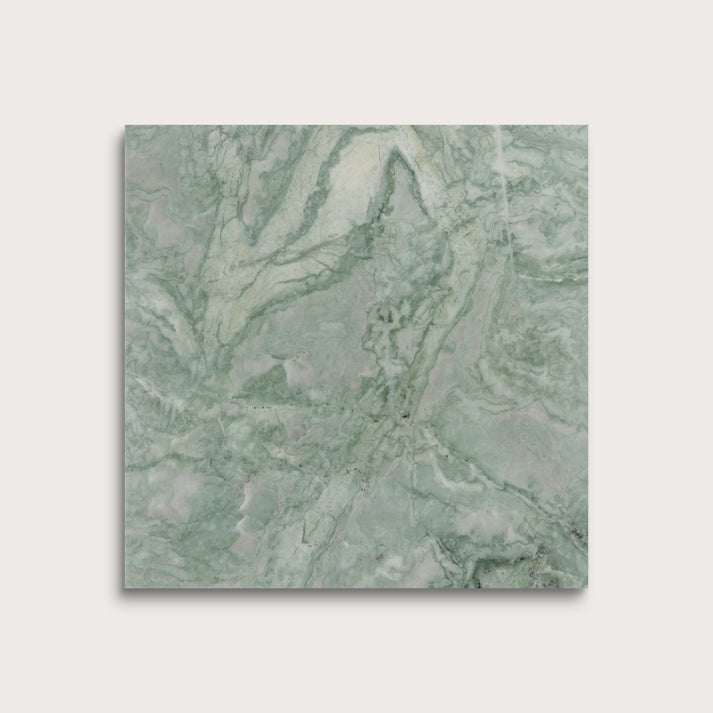 Green marble-patterned tile on a light gray background