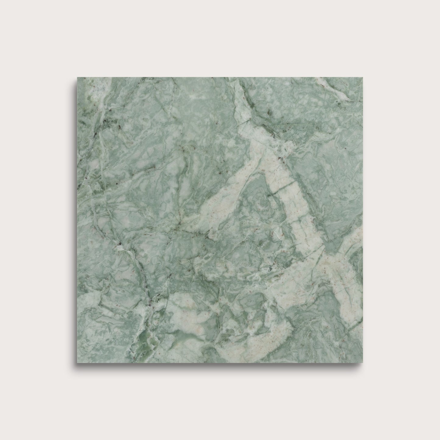 Green marble-patterned tile on a light gray background