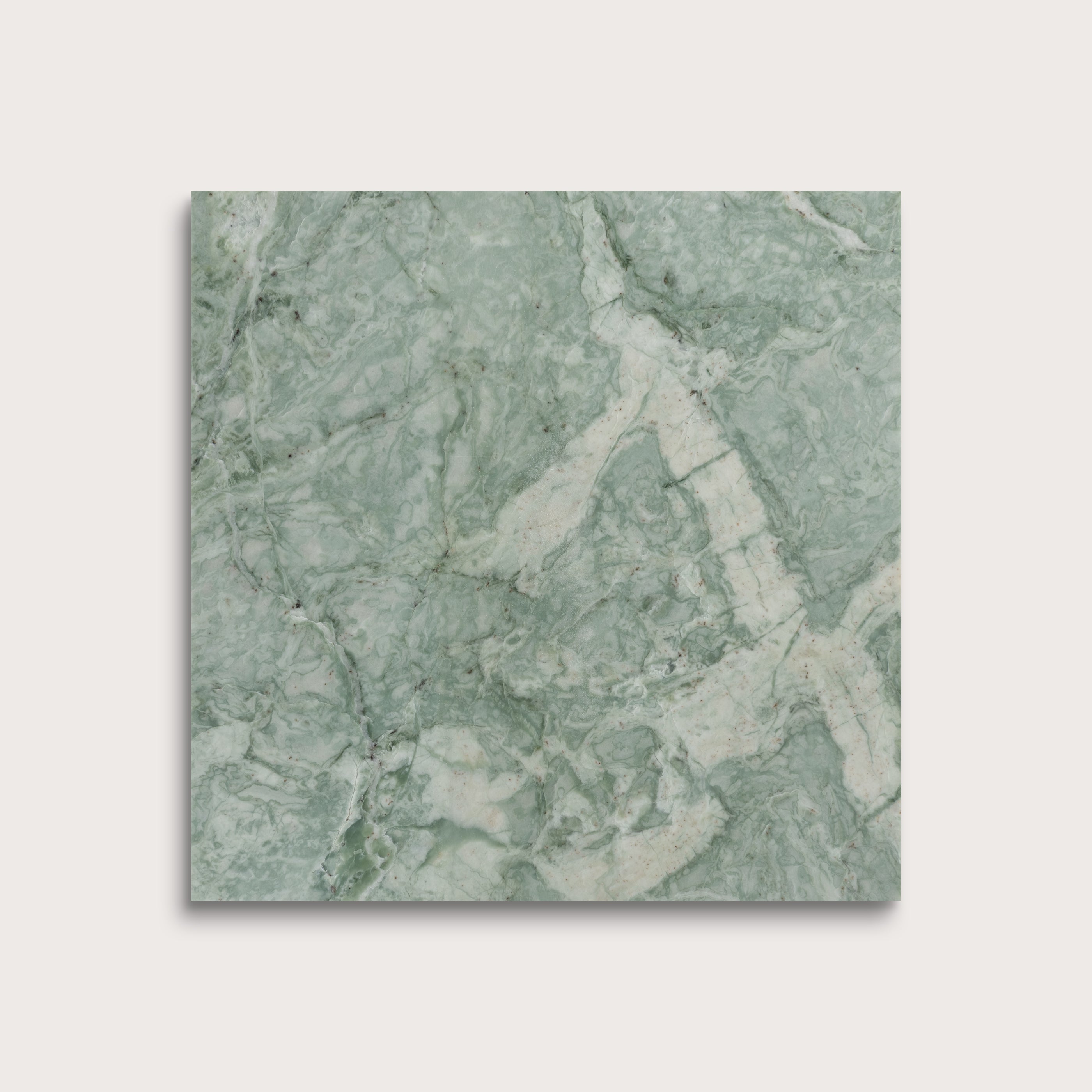 Green marble-patterned tile on a light gray background