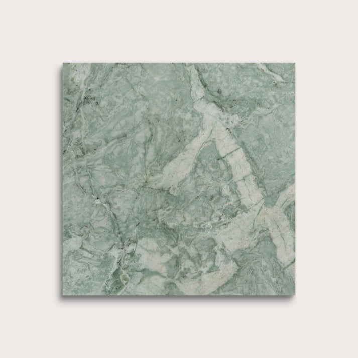 Green marble-patterned tile on a light gray background