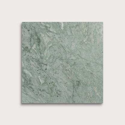 Green marble tile on a light gray background