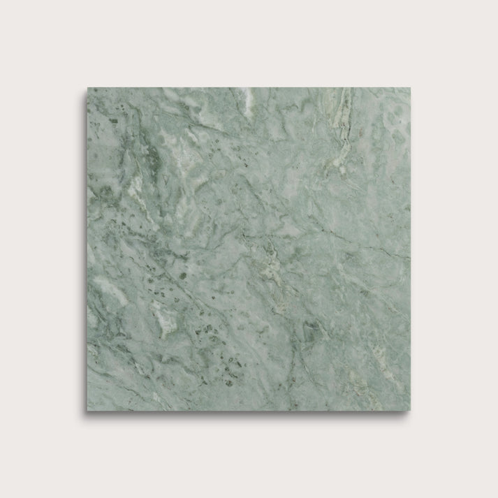 Green marble tile on a light gray background