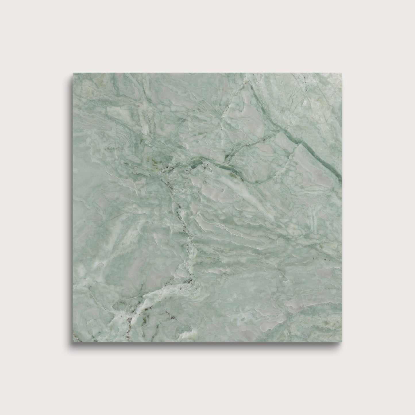 Green marble tile on a light gray background