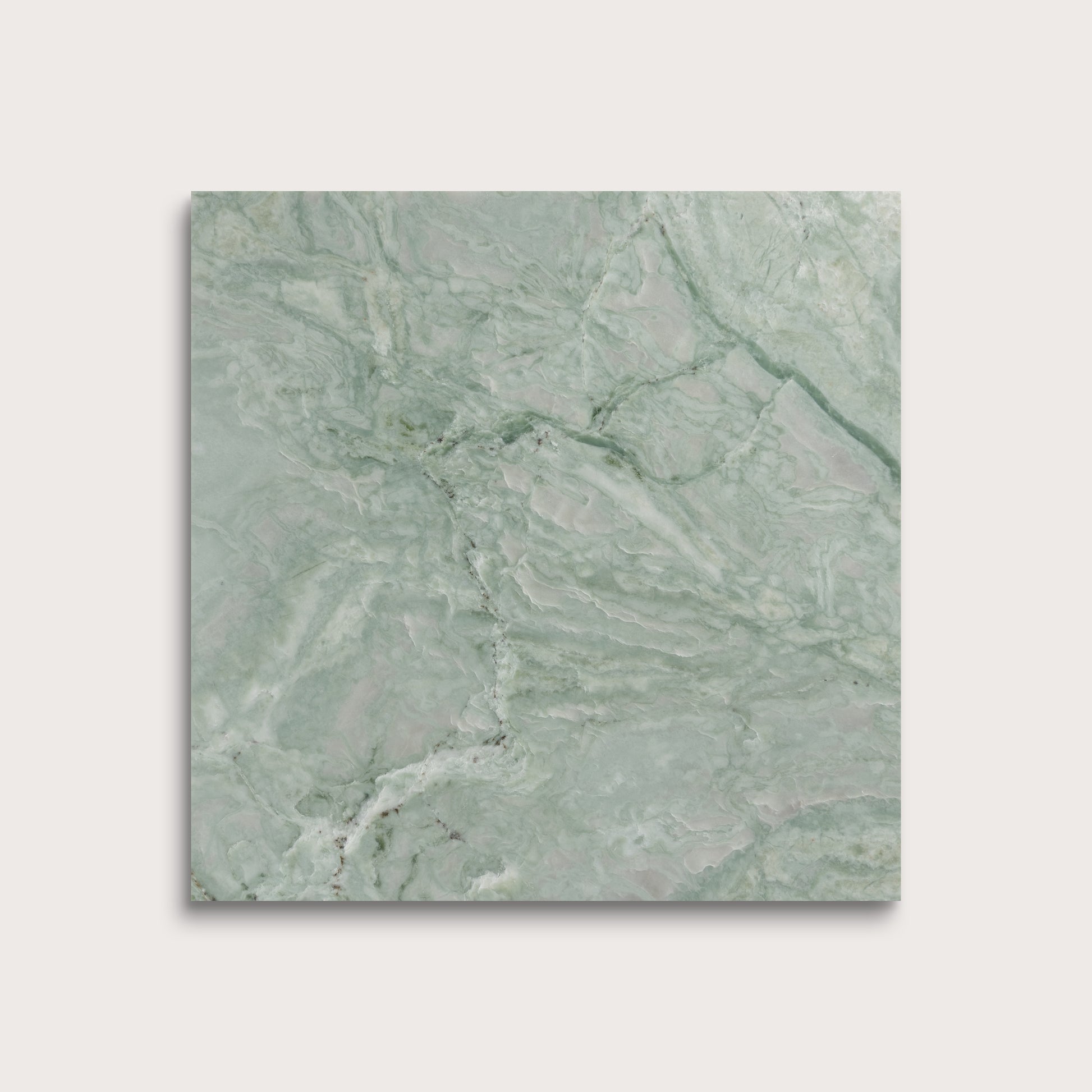Green marble tile on a light gray background