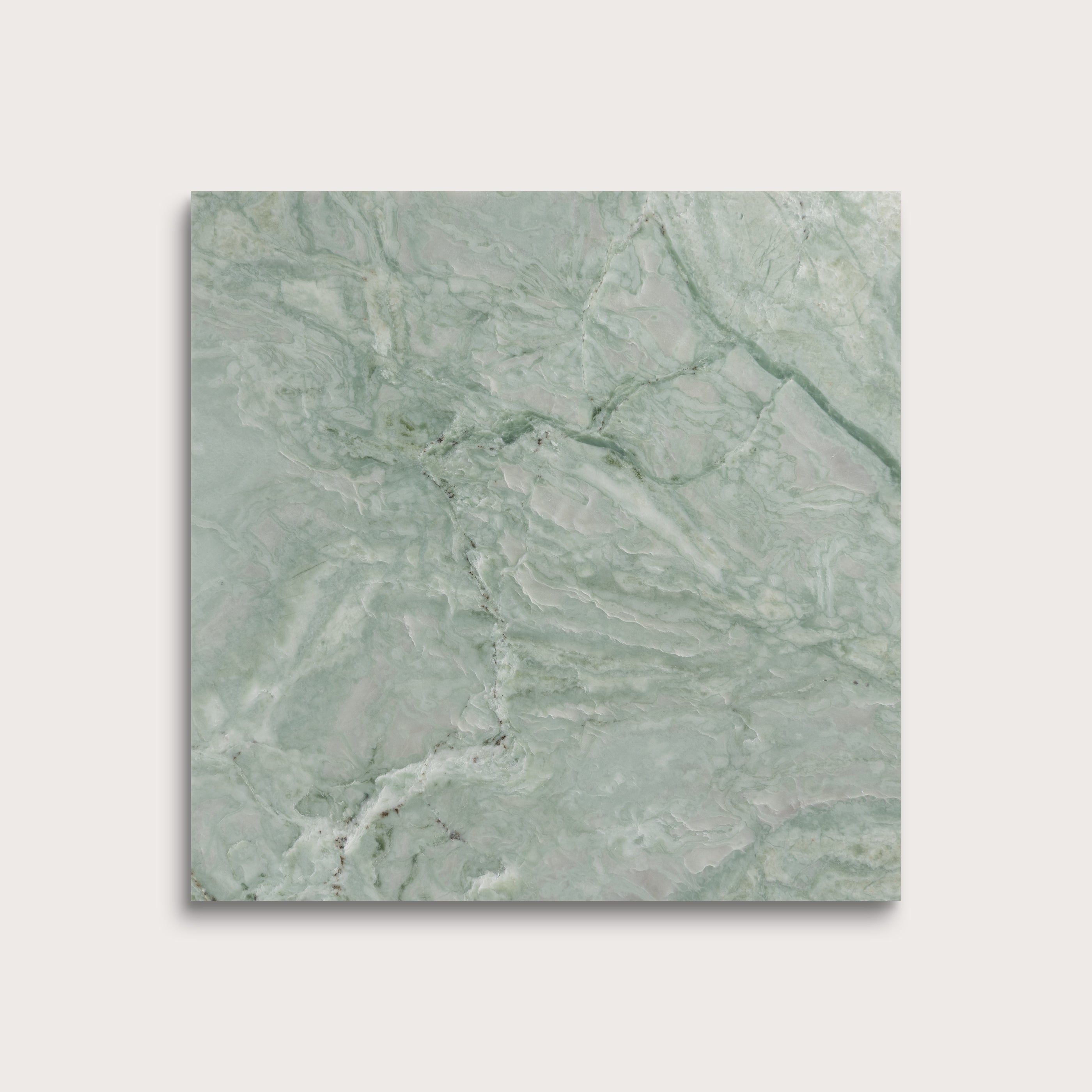 Green marble tile on a light gray background