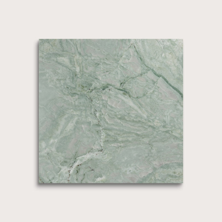Green marble tile on a light gray background