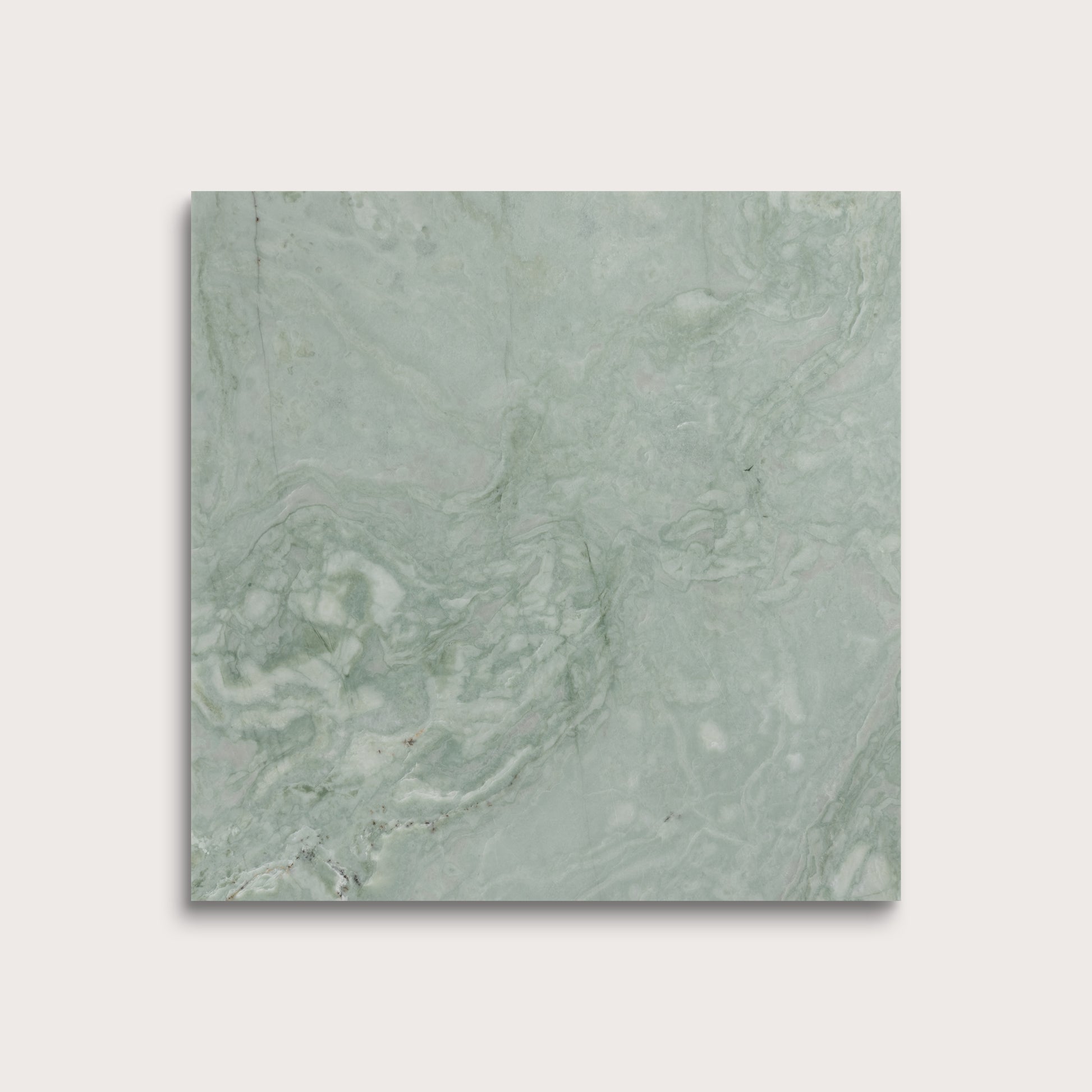 Green marble tile on a light gray background
