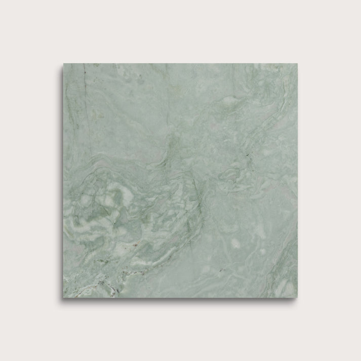 Green marble tile on a light gray background