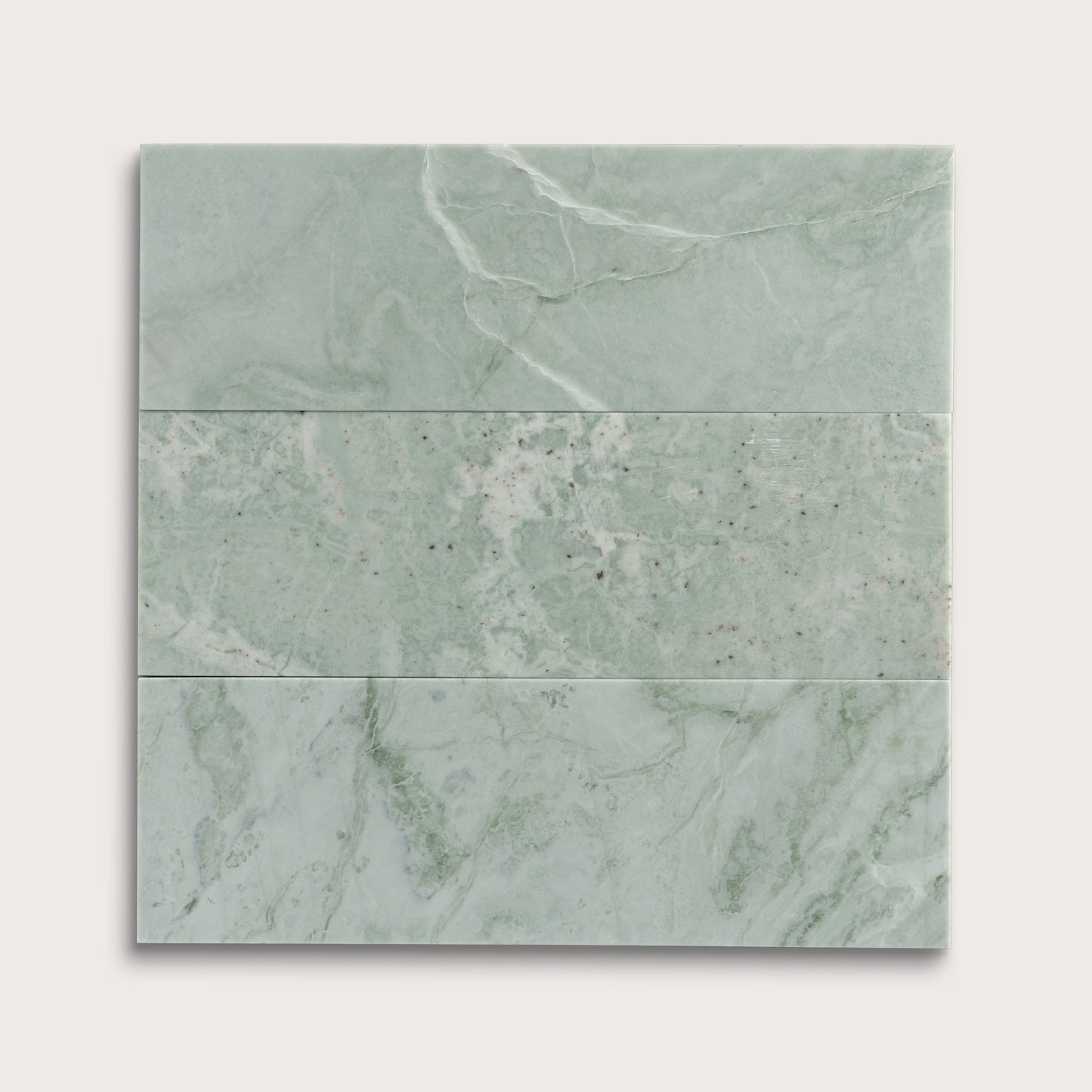 Set of green marble tiles on a white background
