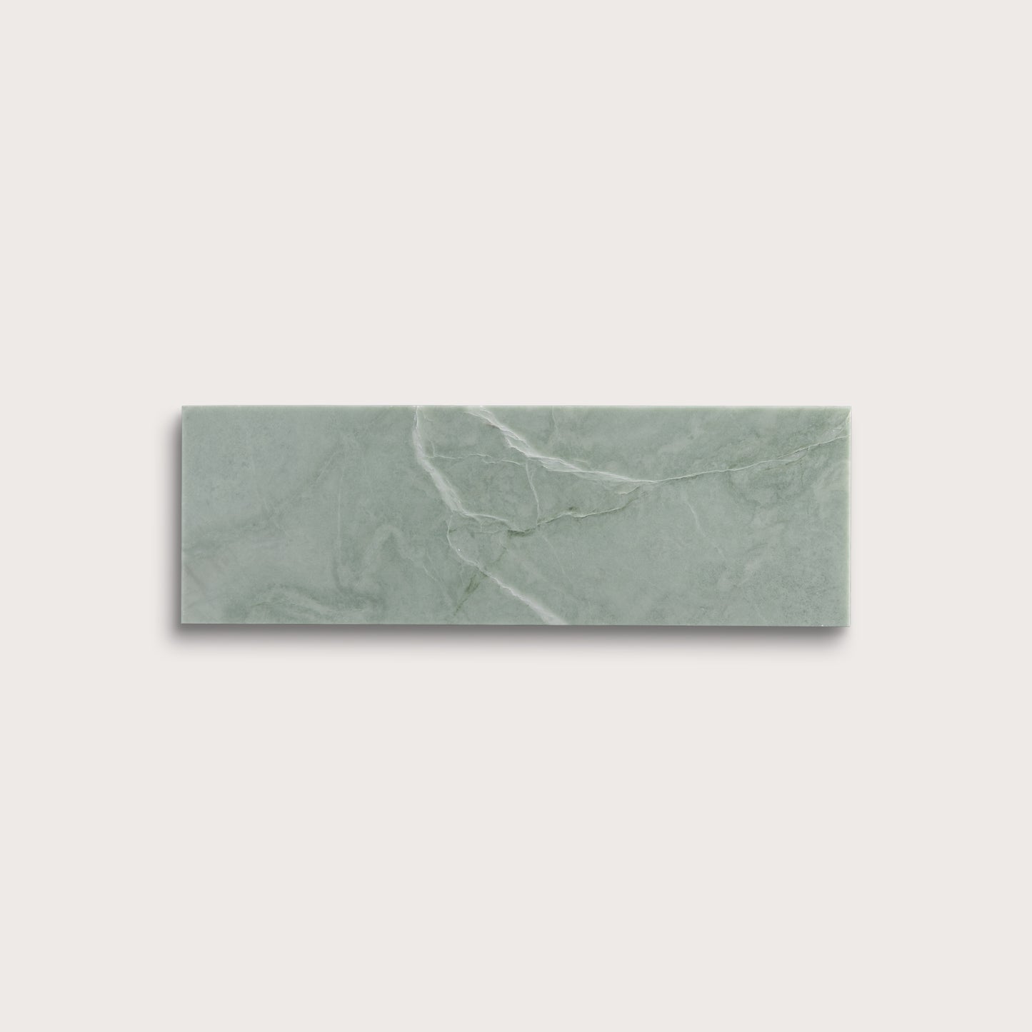 Rectangular green marble tile on a light gray background