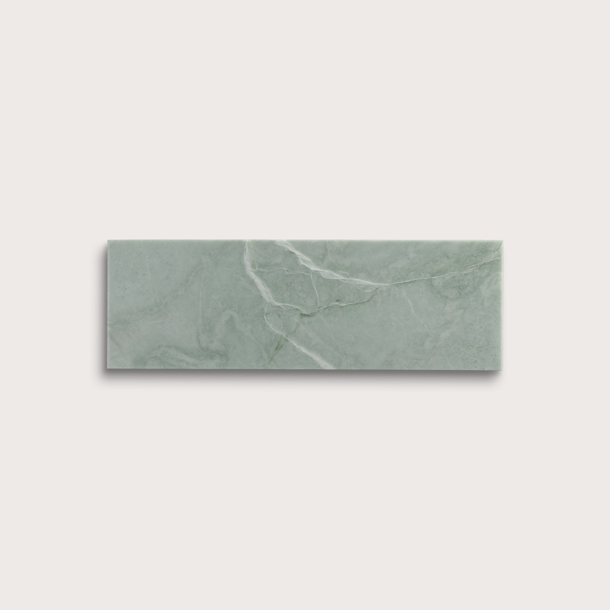 Rectangular green marble tile on a light gray background