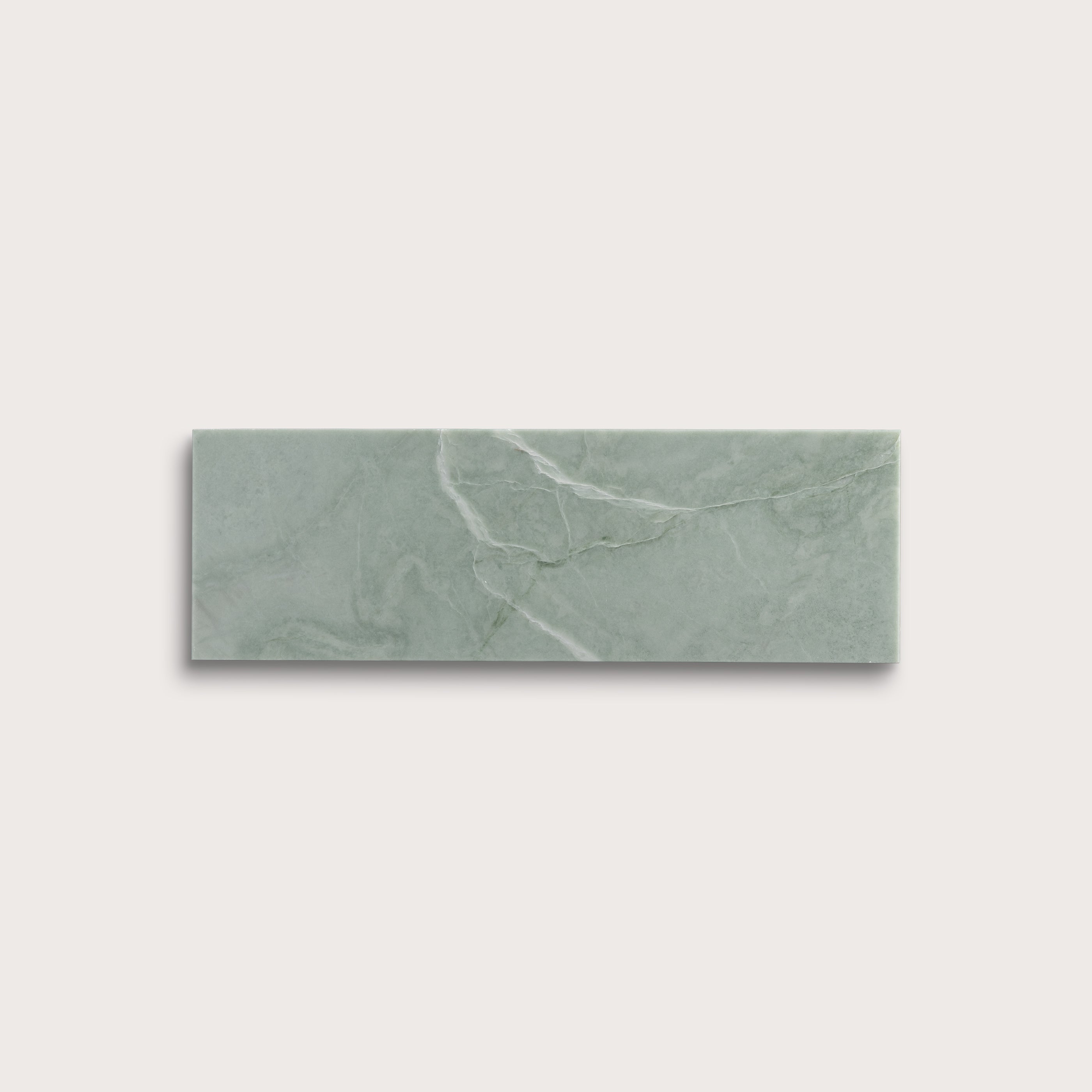Rectangular green marble tile on a light gray background