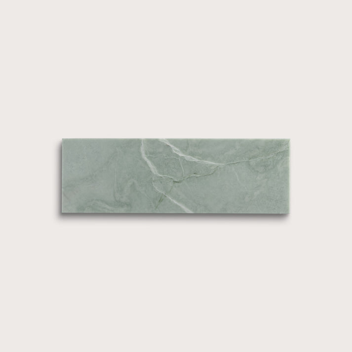 Rectangular green marble tile on a light gray background