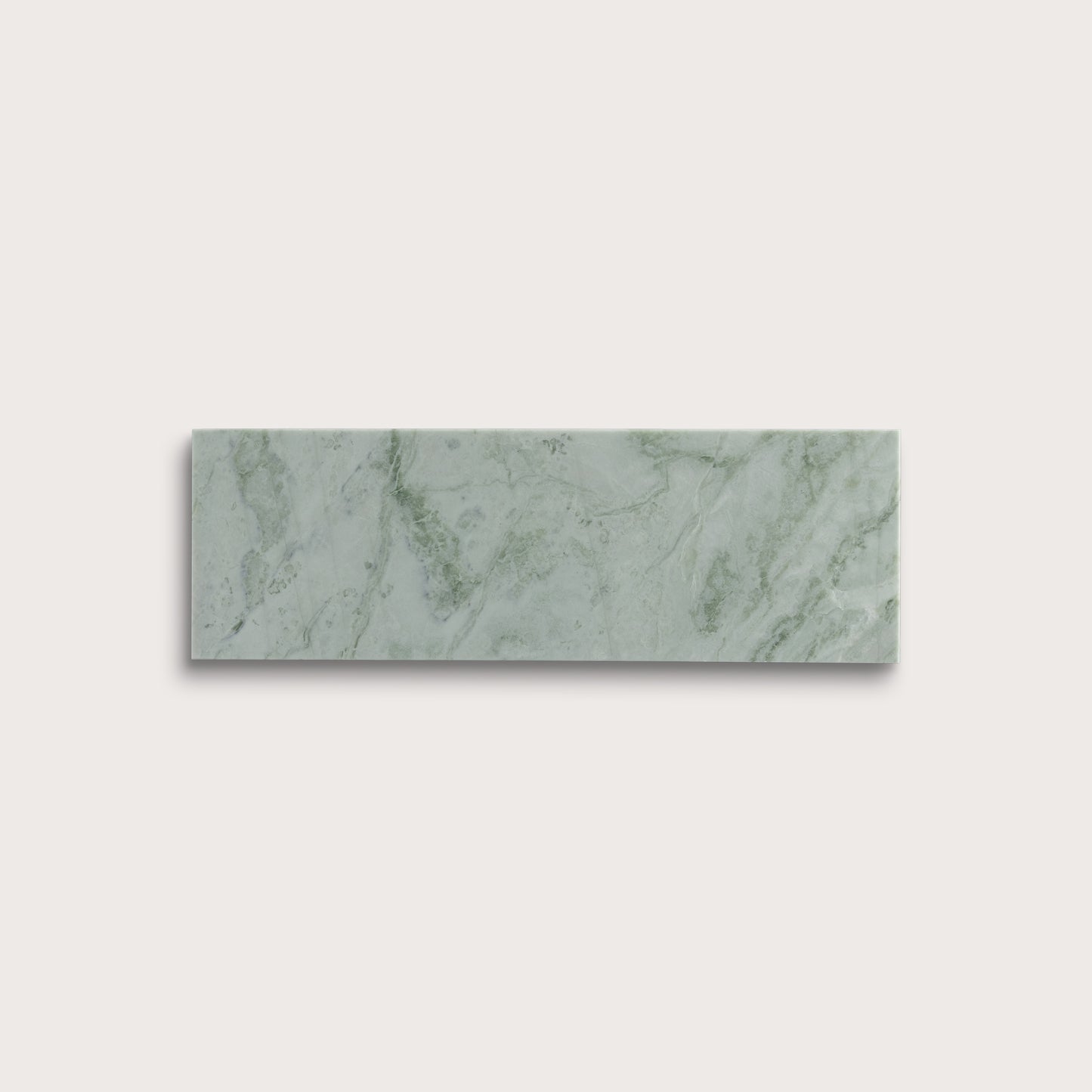 Rectangular green marble tile on a light gray background
