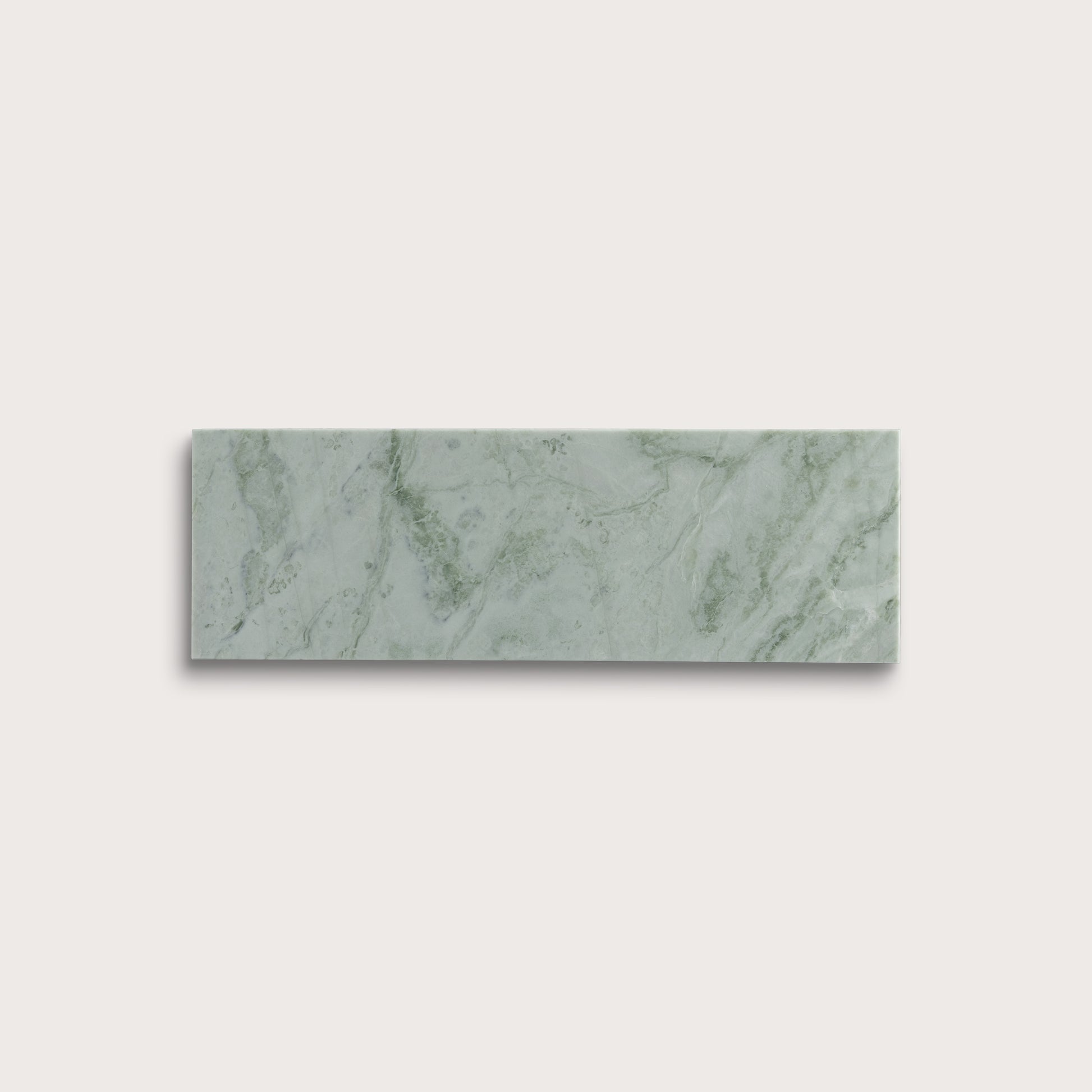 Rectangular green marble tile on a light gray background