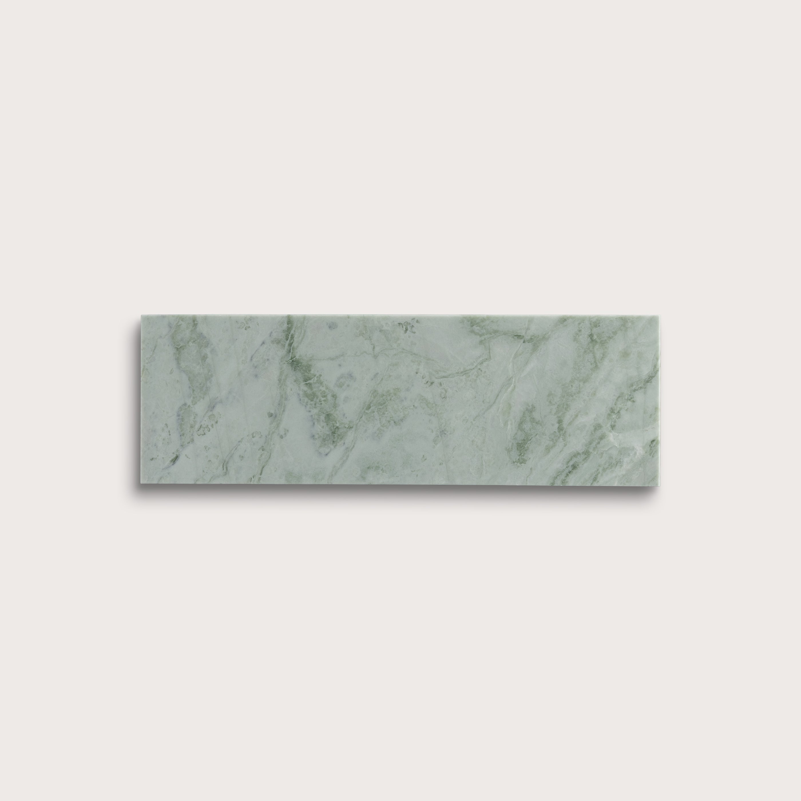 Rectangular green marble tile on a light gray background