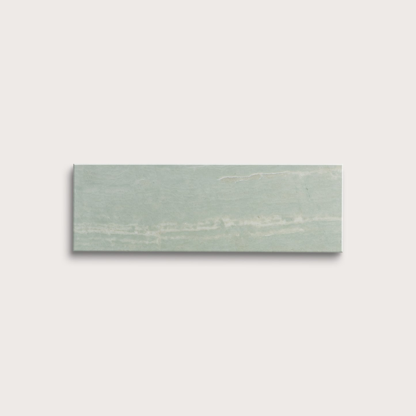 Rectangular green marble tile on a light gray background
