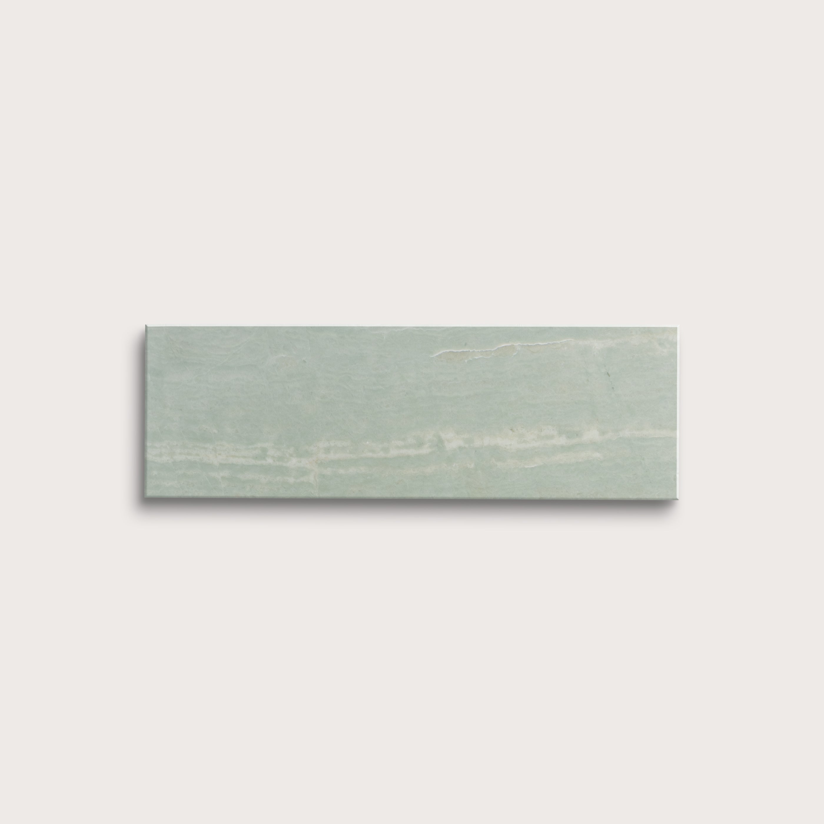 Rectangular green marble tile on a light gray background