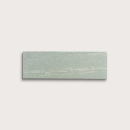 Rectangular green marble tile on a light gray background