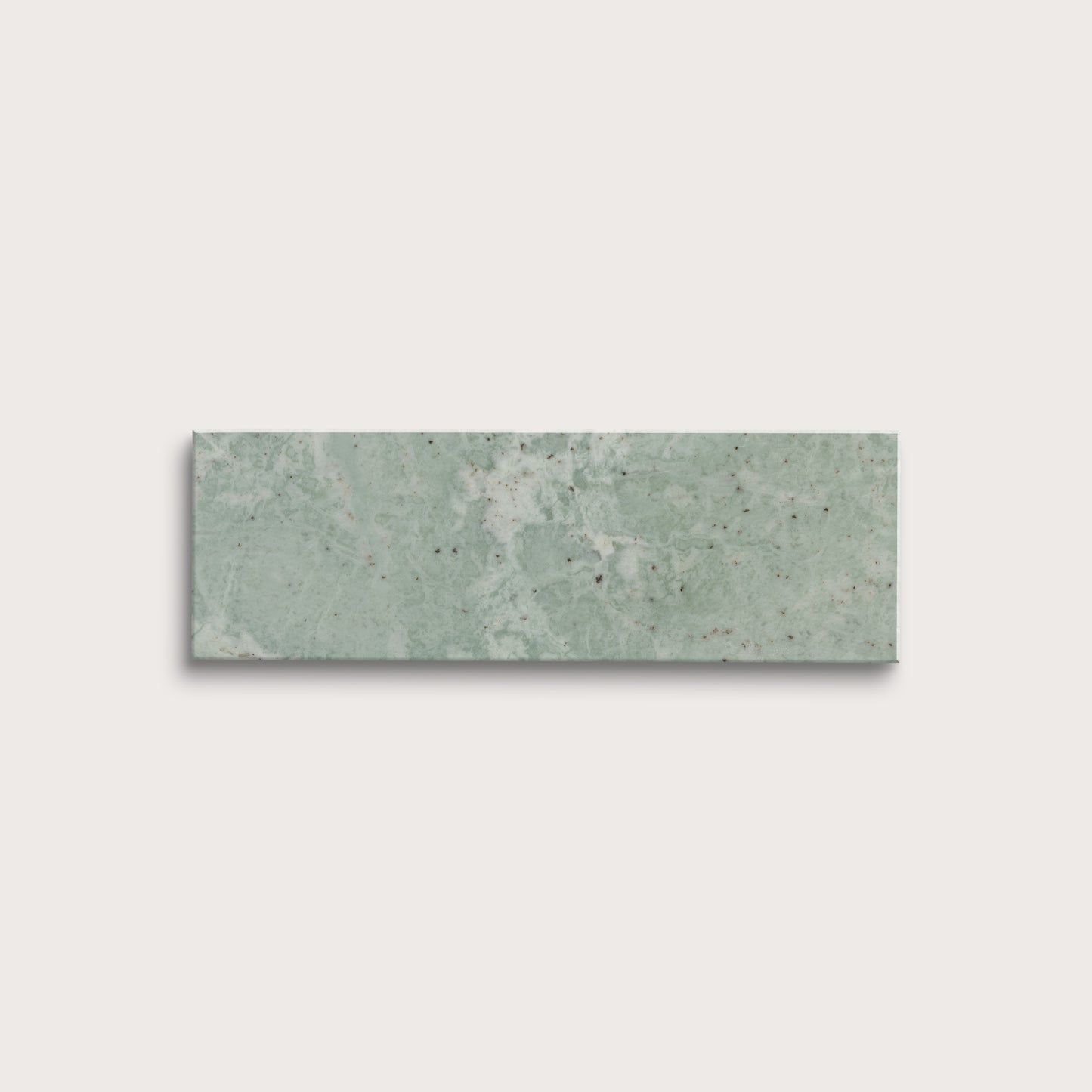 Rectangular green marble tile on a light gray background