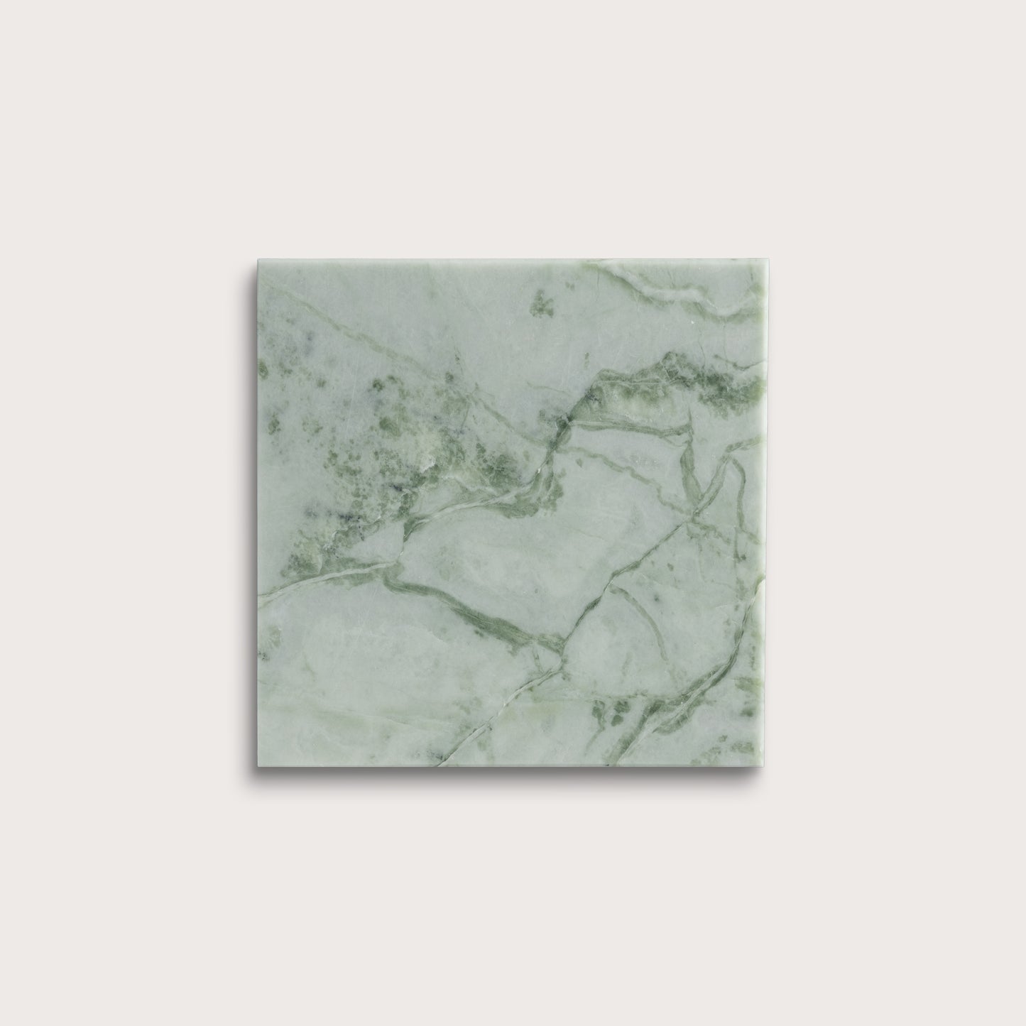 Green marble-patterned tile on a white background