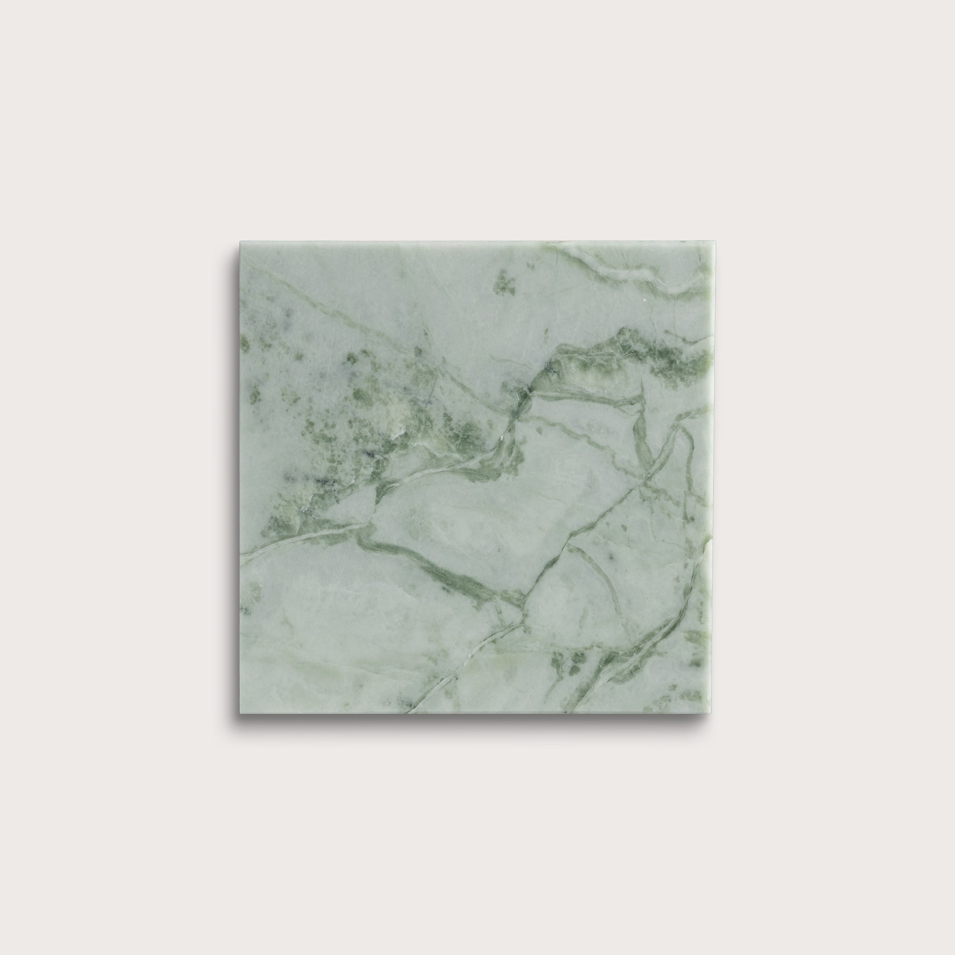 Green marble-patterned tile on a white background