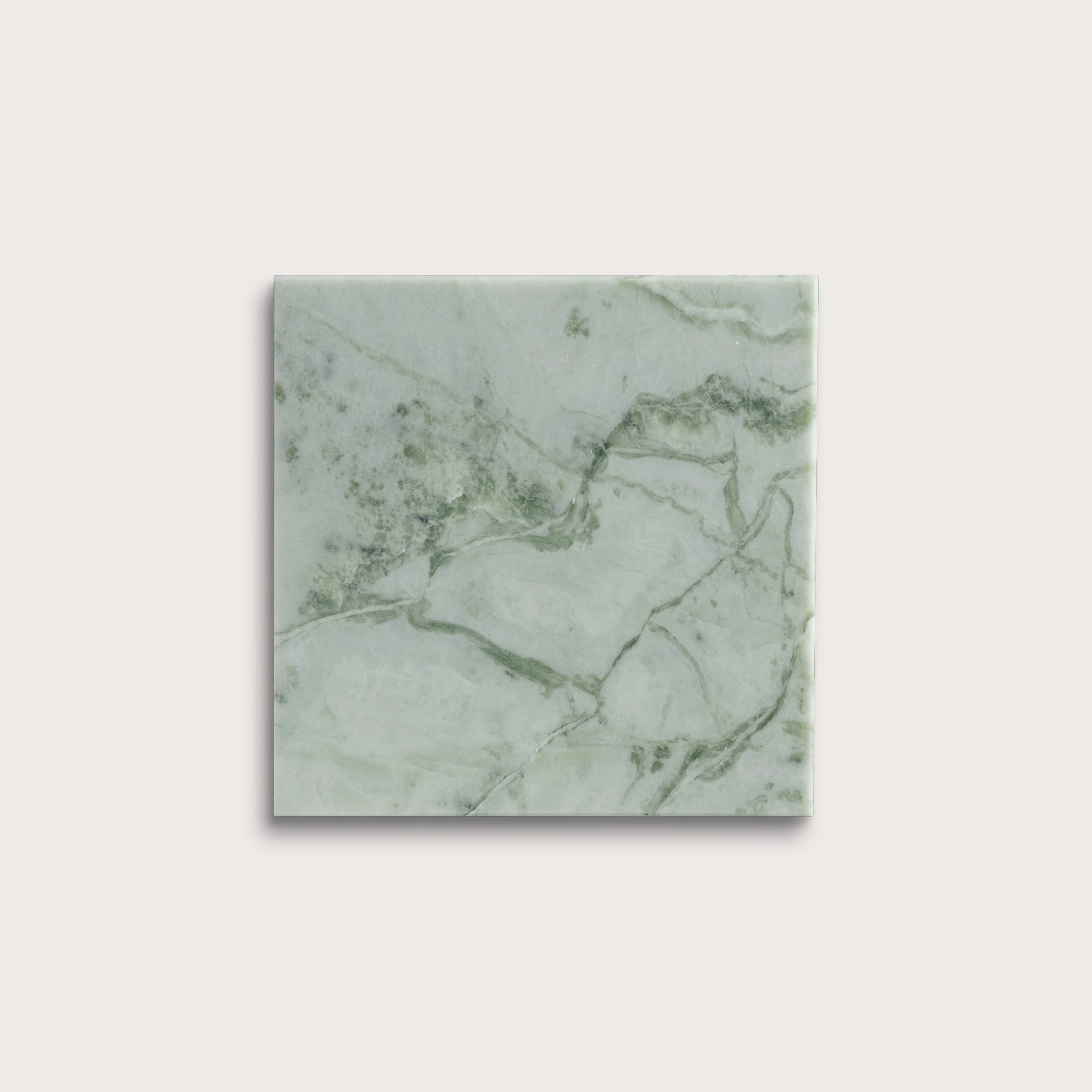 Green marble-patterned tile on a white background