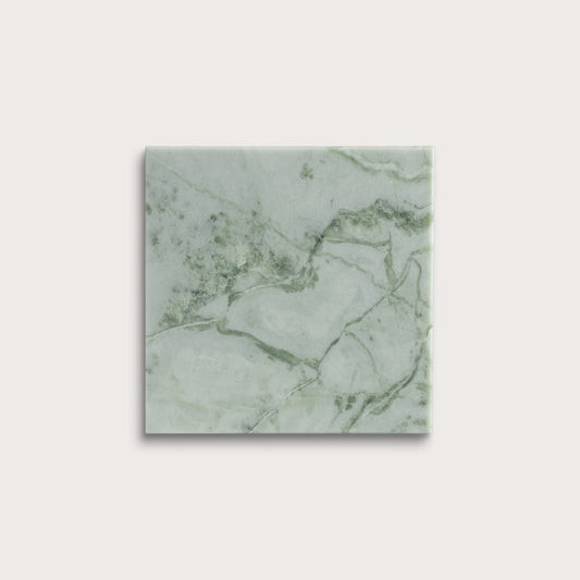 Green marble-patterned tile on a white background