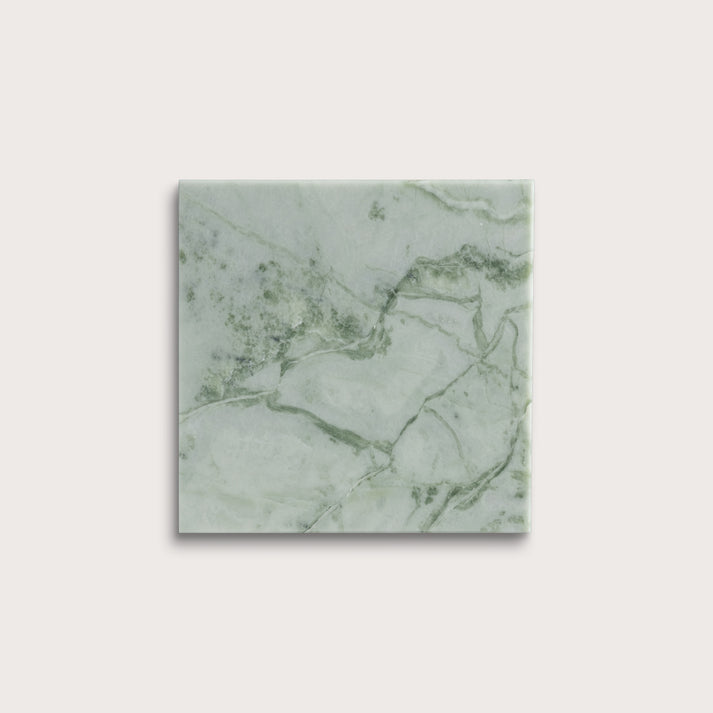 Green marble-patterned tile on a white background