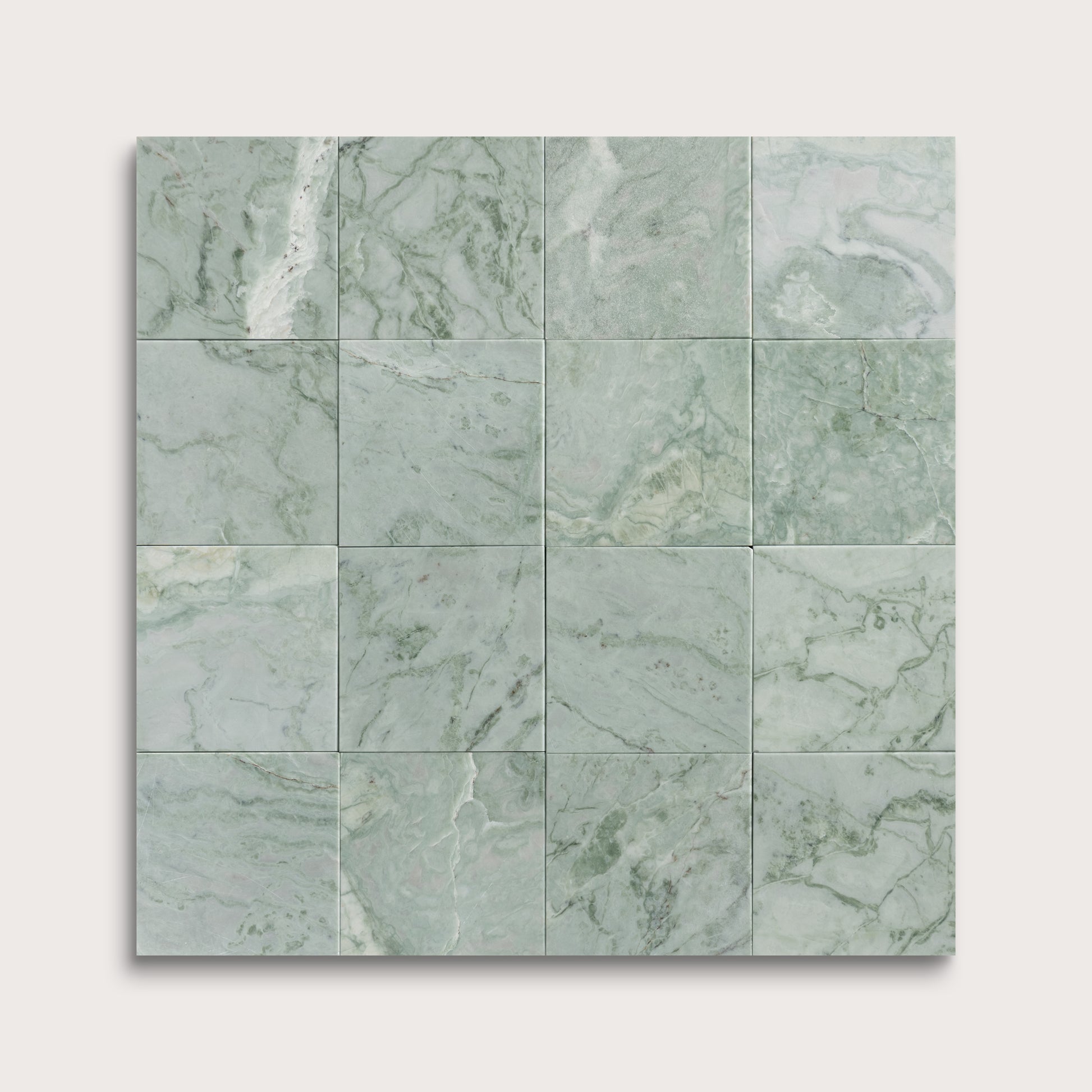 Green marble tiles arranged in a grid pattern on a white background