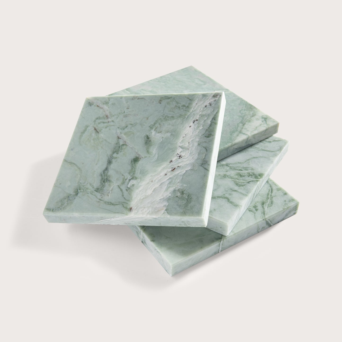 Green marble-patterned tile stacked on a white background