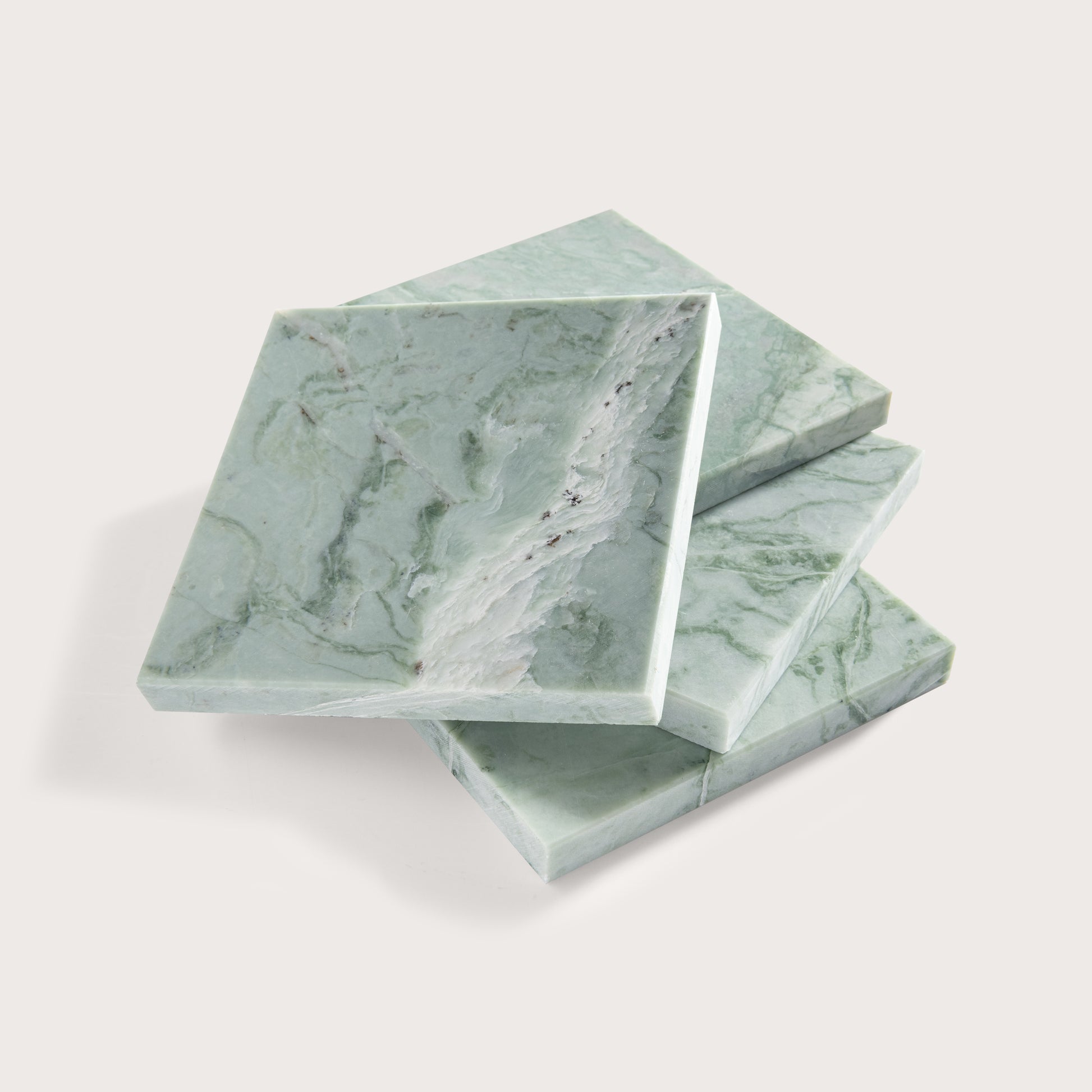 Green marble-patterned tile stacked on a white background