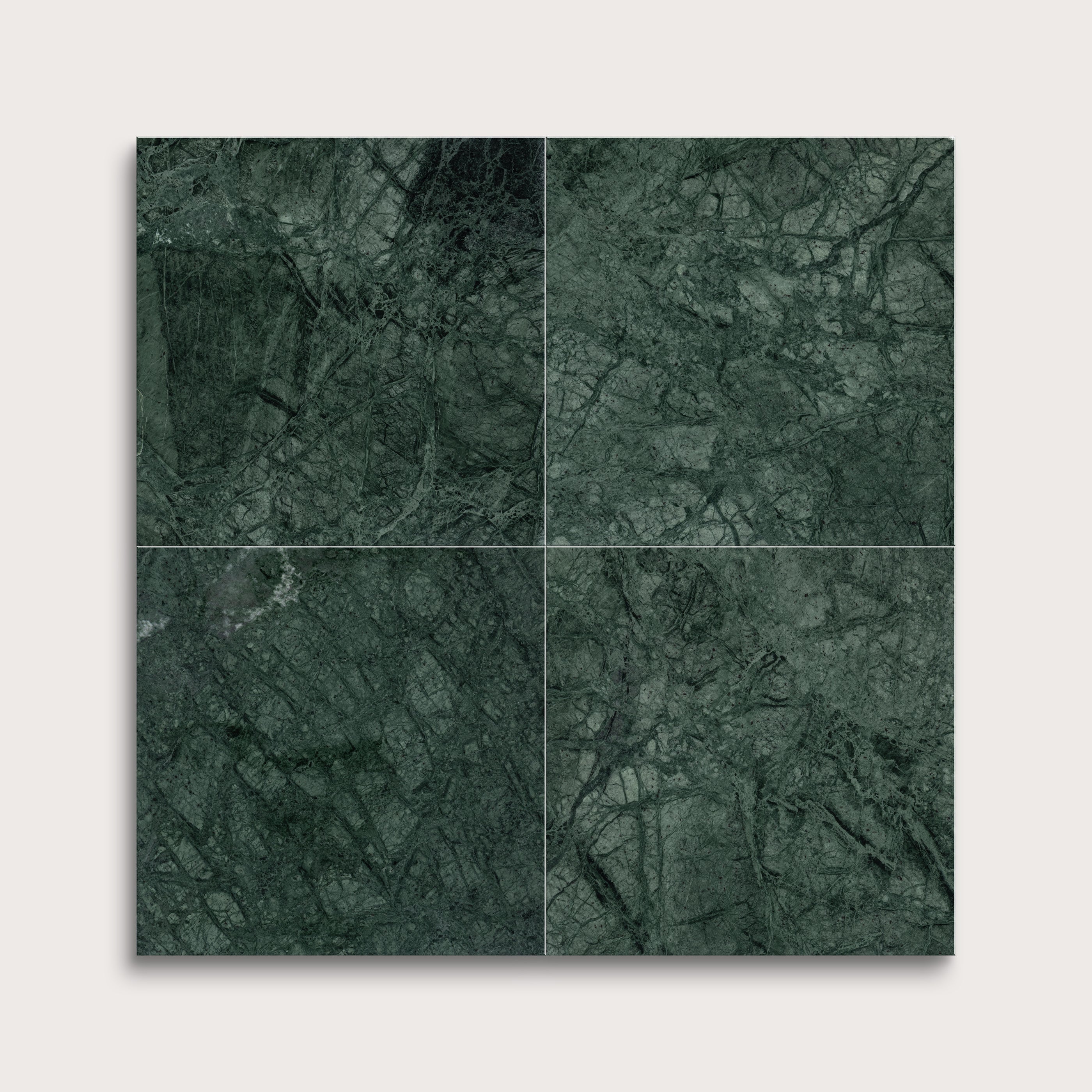 Four green marble tiles arranged in a grid on a light gray background