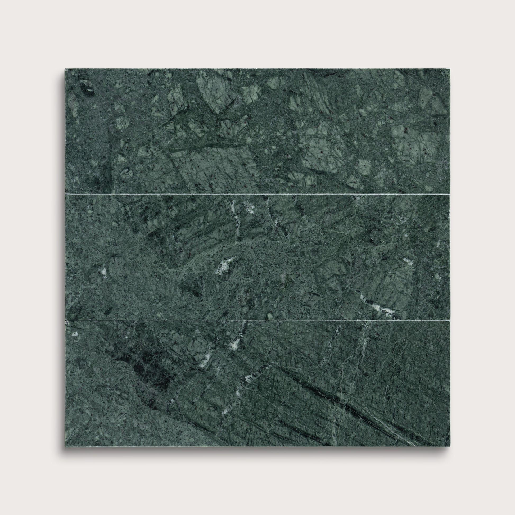 Green marble tiles arranged in a grid pattern on a white background