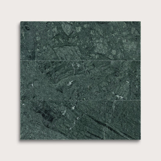 Green marble tiles arranged in a grid pattern on a white background