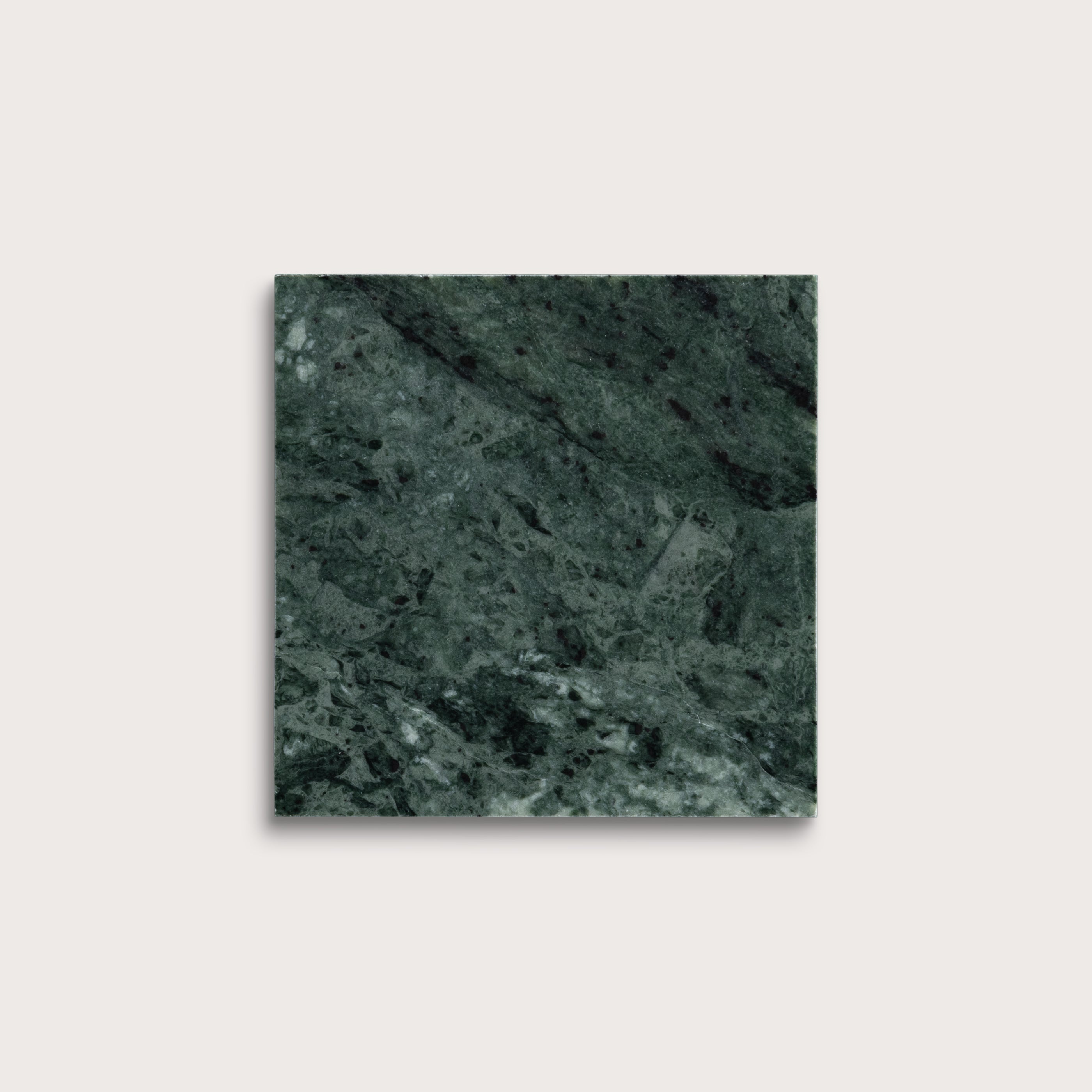 Square tile with a green marble pattern on a light gray background