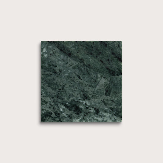 Square tile with a green marble pattern on a light gray background