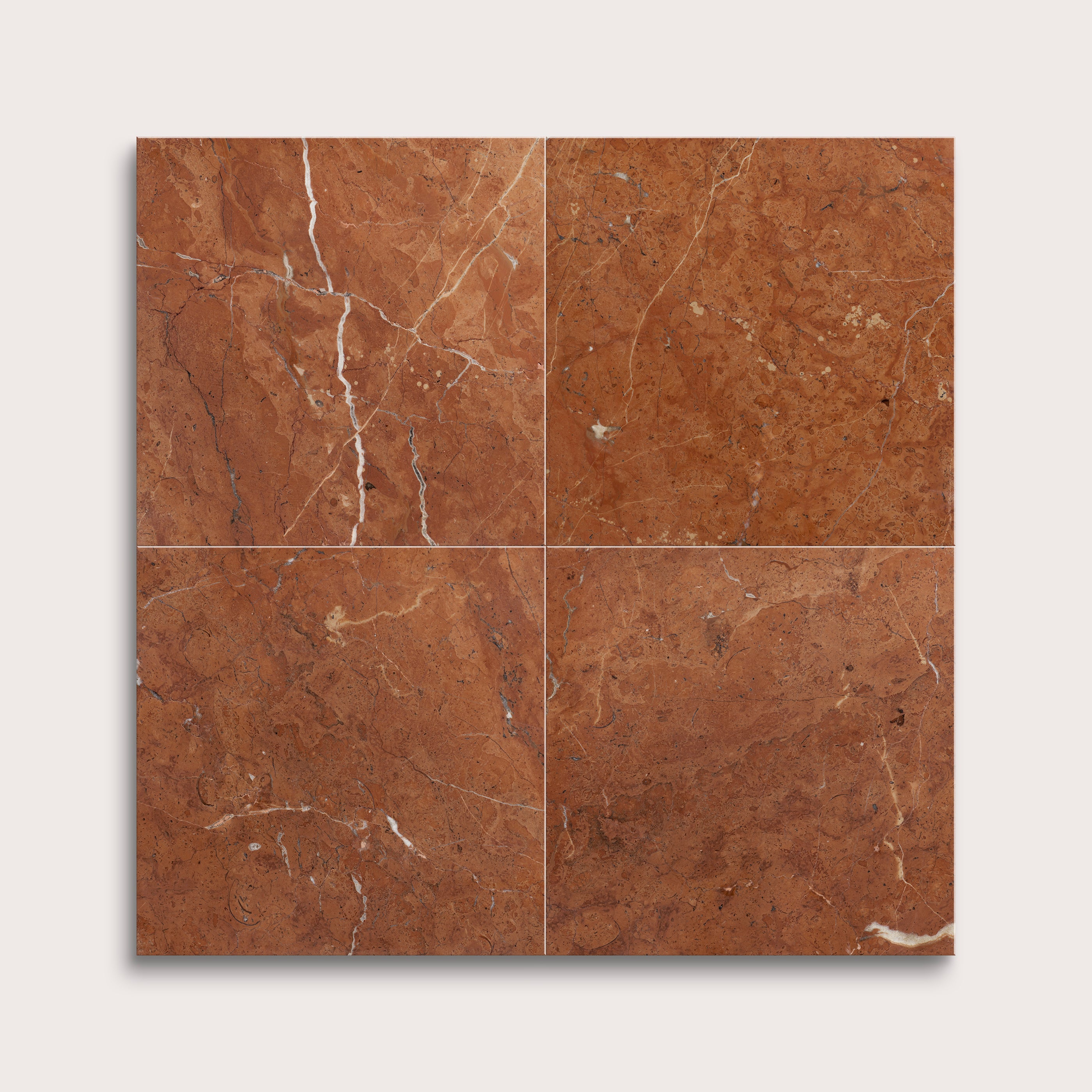 Brown marble tiles with visible veins on a white background