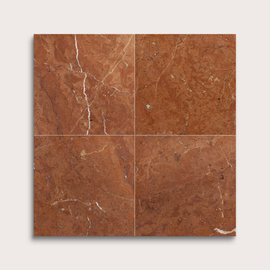 Brown marble tiles with visible veins on a white background