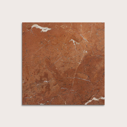 Brown marble tile with white veins on a light gray background