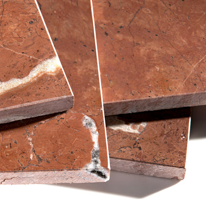 Close-up of brown tiles with a marble-like texture on a white background