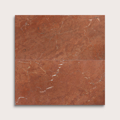 Brown marble tile with visible veins on a white background