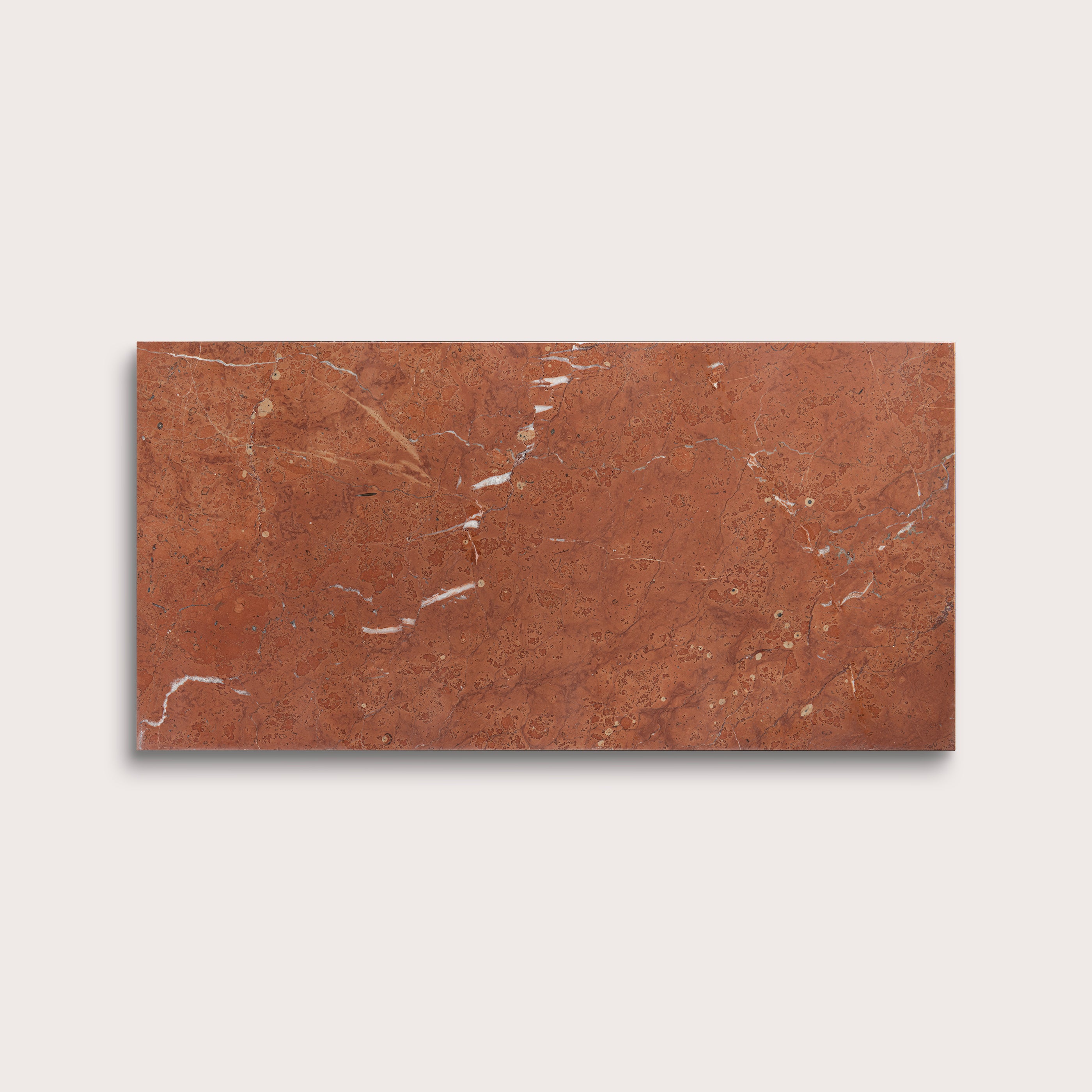 Rectangular brown tile with a marbled pattern on a light gray background