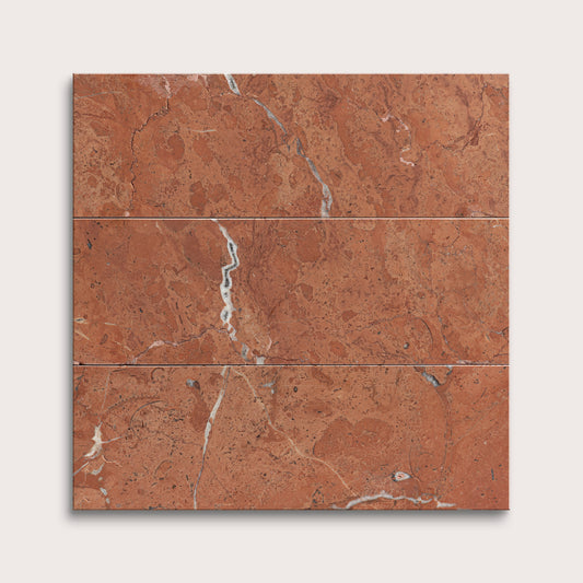 Brown marble tiles with a subtle pattern on a white background