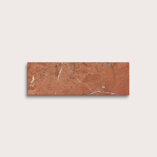 Rectangular brown tile with marble-like pattern on a light gray background